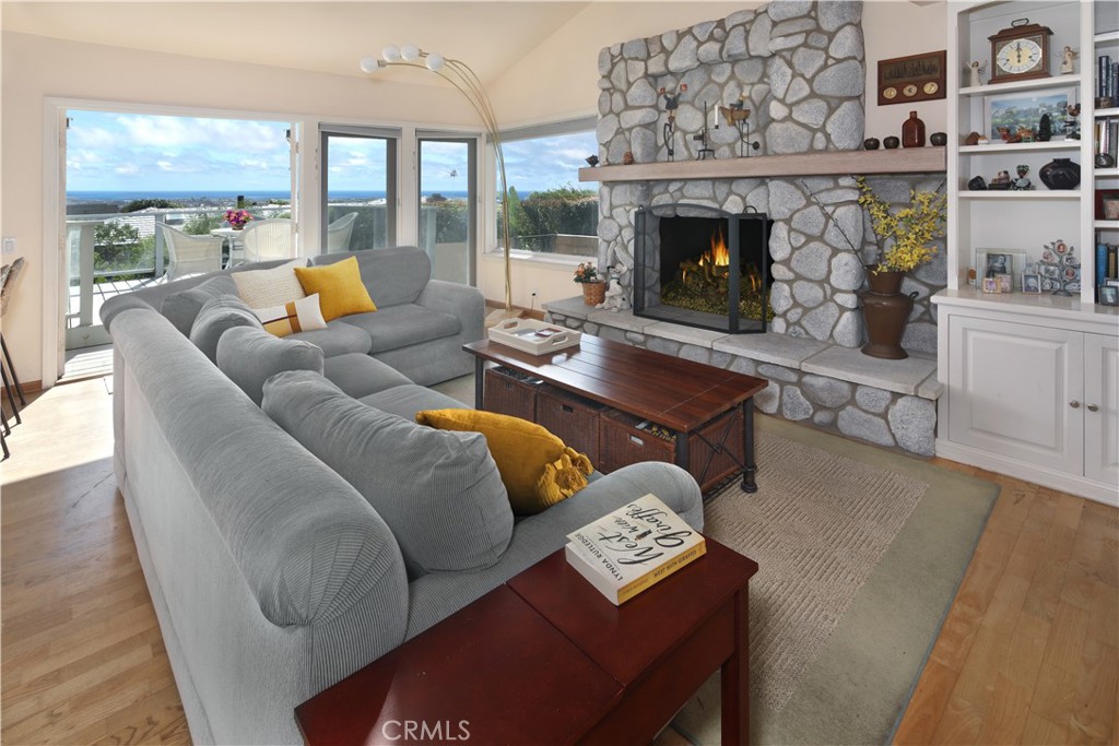 23262 Ellice Circle Dana Point, CA 92629 - Photo 8 of 10 a living room with furniture and a fireplace