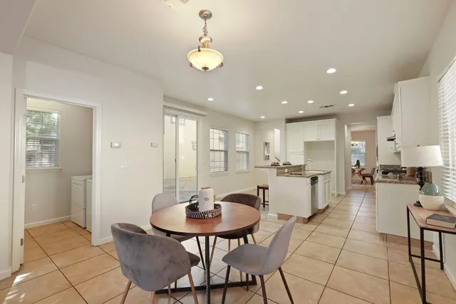 a view of a dining room and kitchen