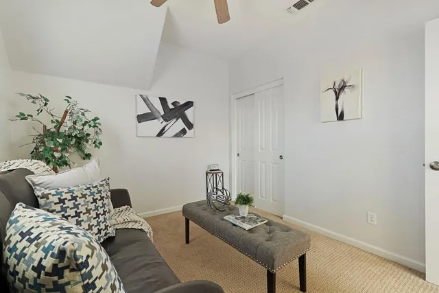a bedroom with furniture and a window