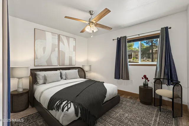 a bedroom with a large bed and a window