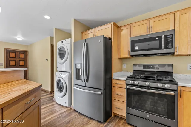 a kitchen with a stove and a microwave