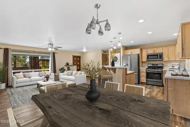 a view of a kitchen and dining room