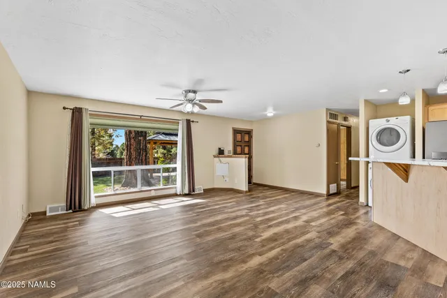 a view of a kitchen with a sink and a microwave