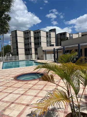a view of swimming pool with outdoor seating