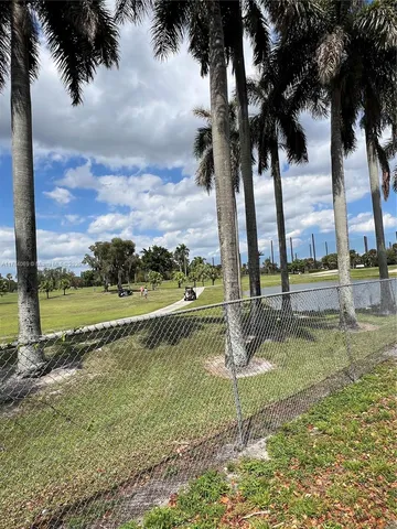 a view of a garden with swimming pool