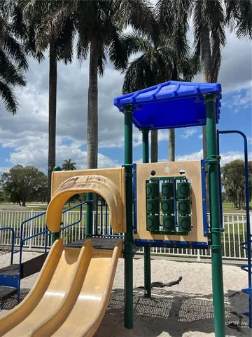 a view of a balcony with a table and chairs