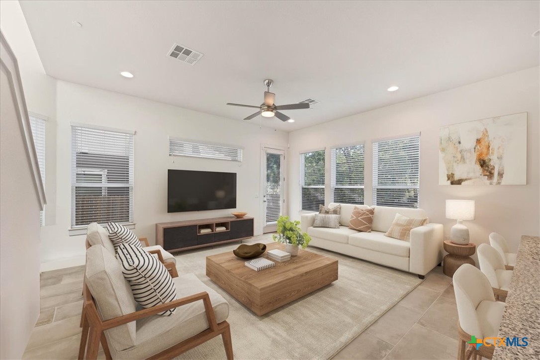 8922 Manchaca Road, Unit 906 Austin, TX 78748 - Photo 3 of 16 a living room with furniture and a flat screen tv