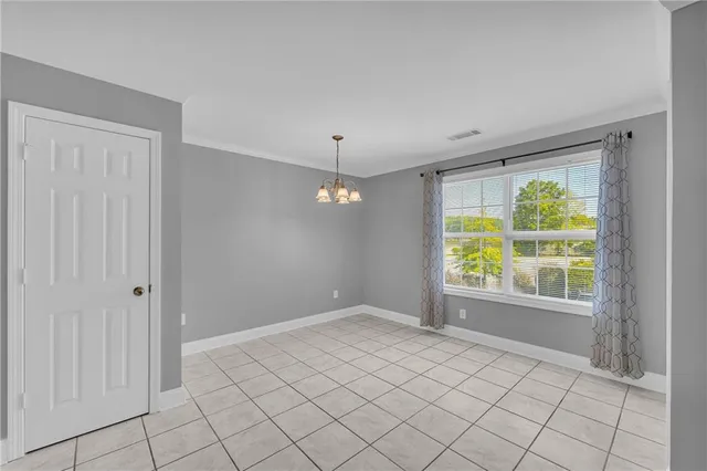 a kitchen with sink and cabinets