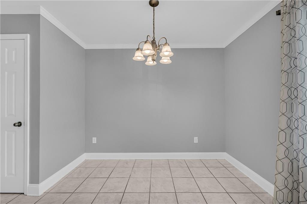 105 Whitehead Road, Unit 17 Athens, GA 30606 - Photo 20 of 38 a view of an empty room with chandelier fan
