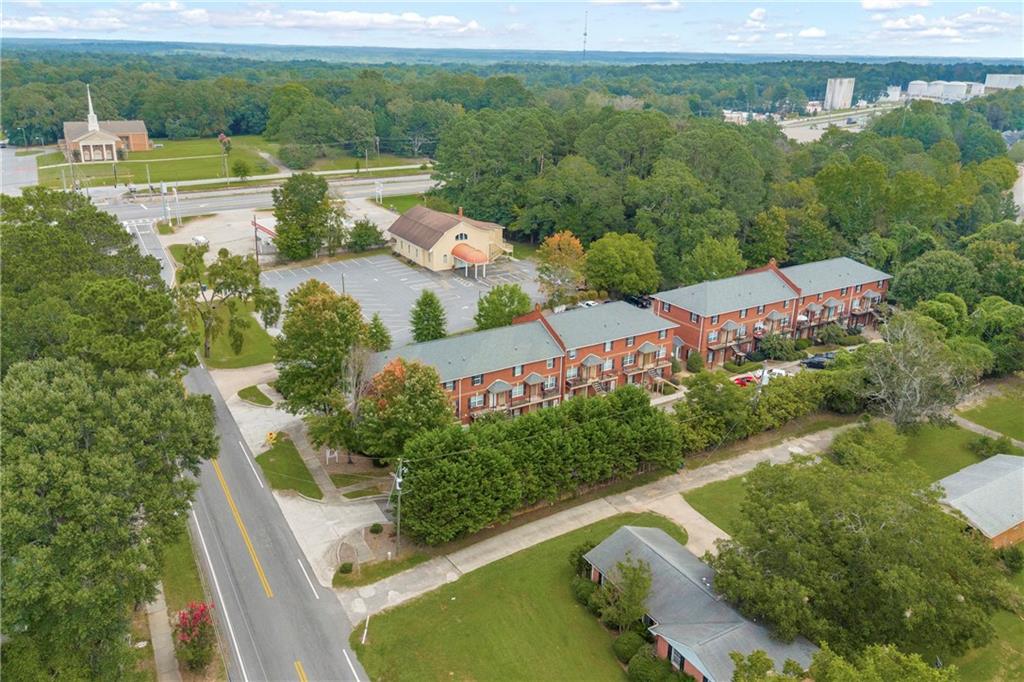 105 Whitehead Road, Unit 17 Athens, GA 30606 - Photo 2 of 38 an aerial view of a house with a garden and lake view