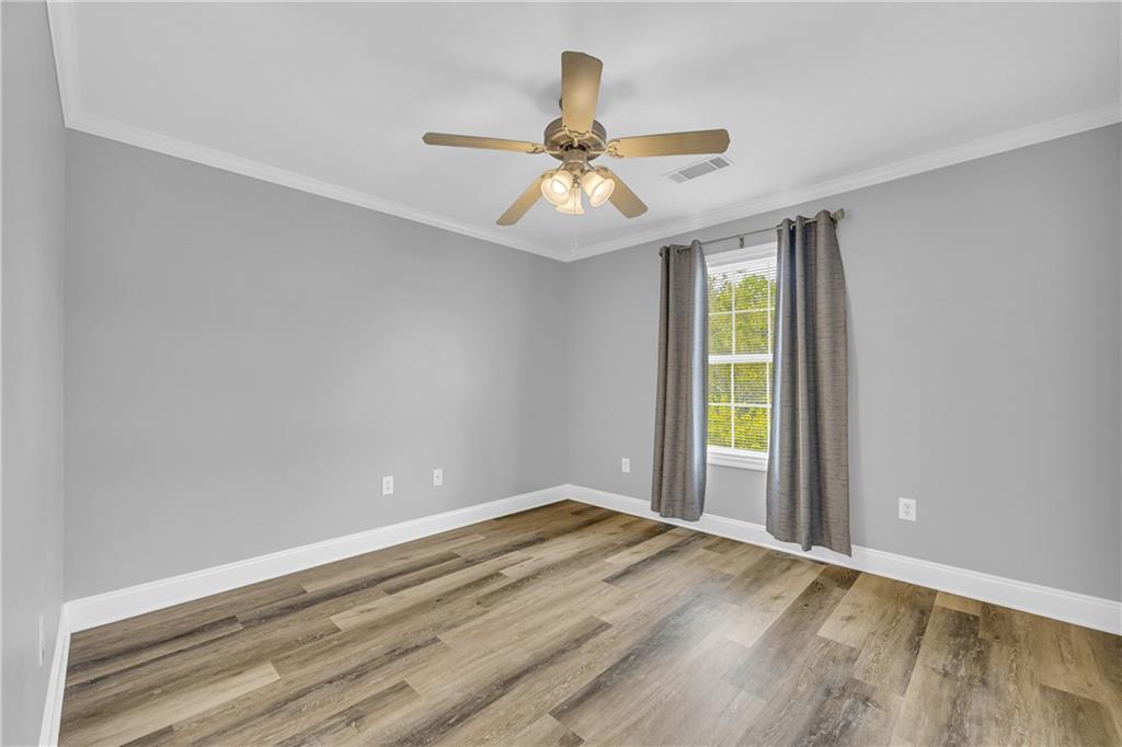 105 Whitehead Road, Unit 17 Athens, GA 30606 - Photo 25 of 38 wooden floor in an empty room with a window