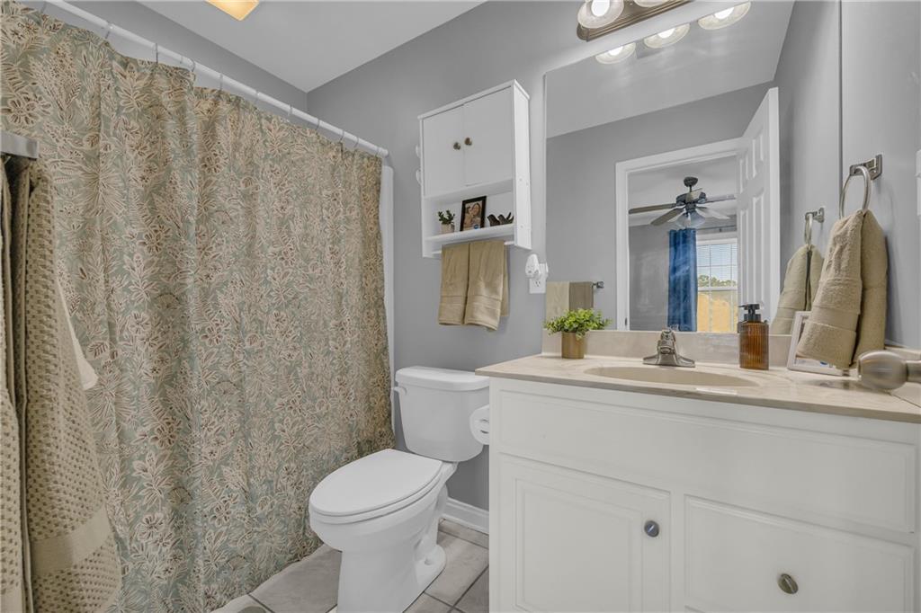 105 Whitehead Road, Unit 17 Athens, GA 30606 - Photo 32 of 38 a bathroom with a sink a toilet and a mirror
