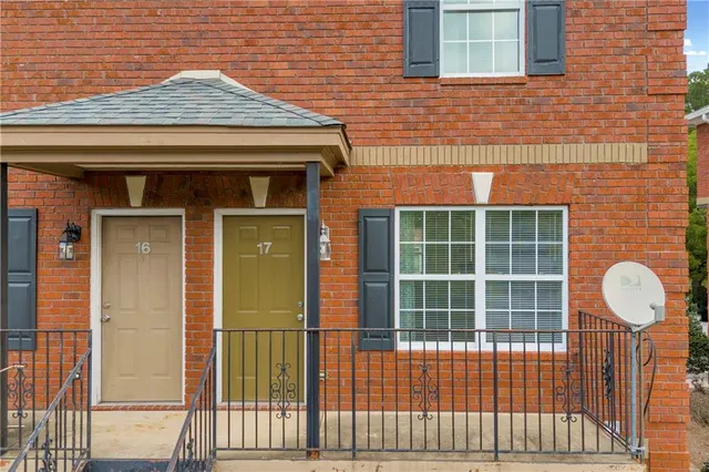a view of a brick house with a large window