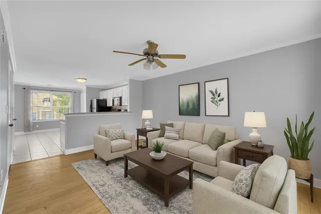 a living room with furniture and a large window