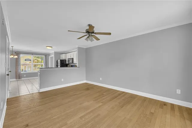 a view of a kitchen with microwave and a sink