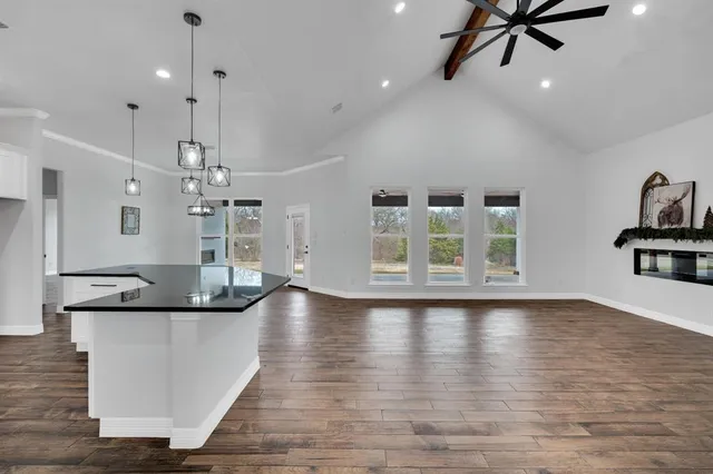a view of a kitchen with marble kitchen and living room