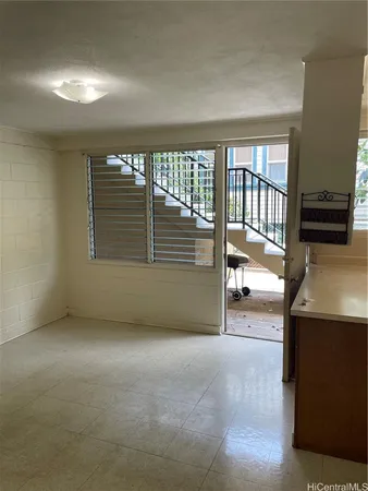 a view of an empty room with a window