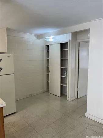 a view of an empty room with a closet