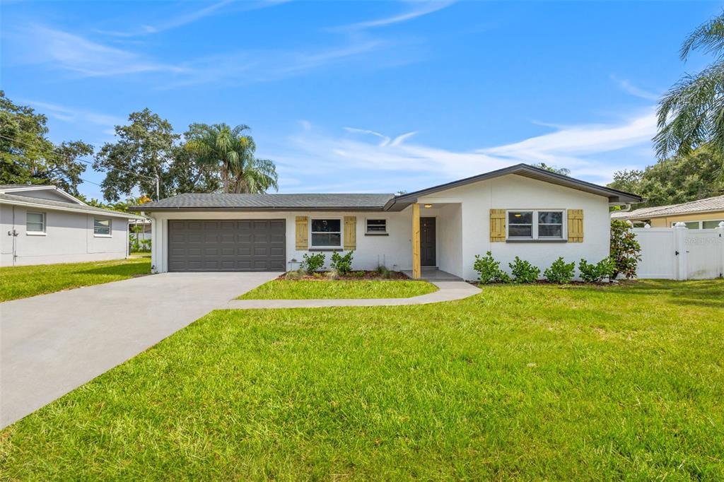 1011 Suemar Road Dunedin, FL 34698 - Photo 1 of 1 a view of a house with pool and a yard