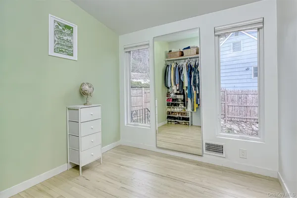 a view of a livingroom with wooden floor and closet
