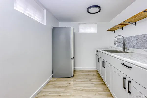 a bathroom with a sink and a mirror