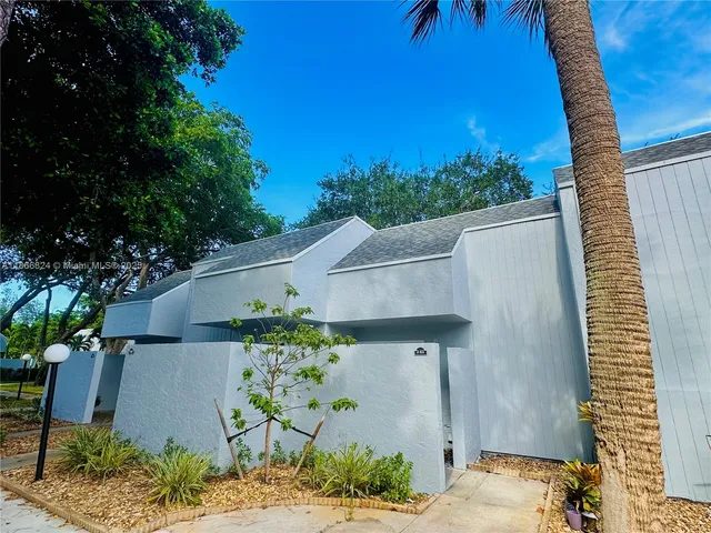 a aerial view of a house with a yard