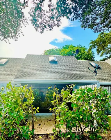 a view of a swimming pool with a potted plants