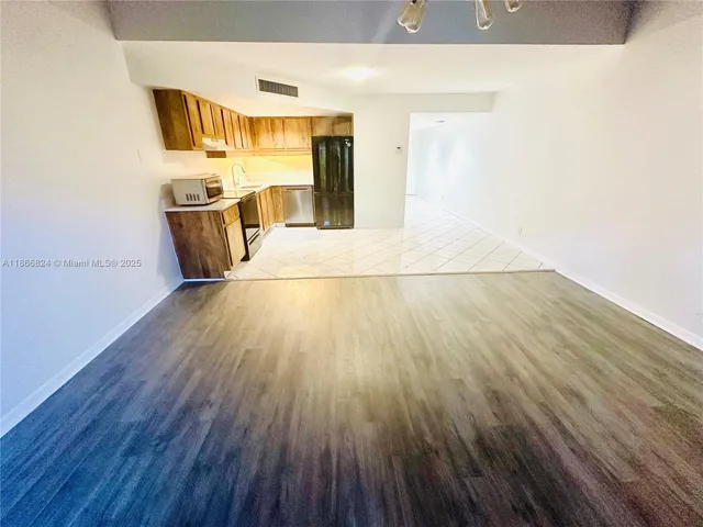 a view of a kitchen from the hallway