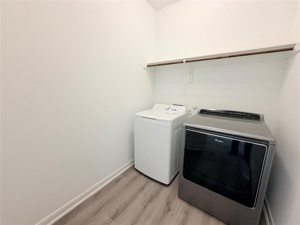 3310 Tanseyleaf Drive Forney, TX 75126 - Photo 11 of 33 a utility room with dryer and washer