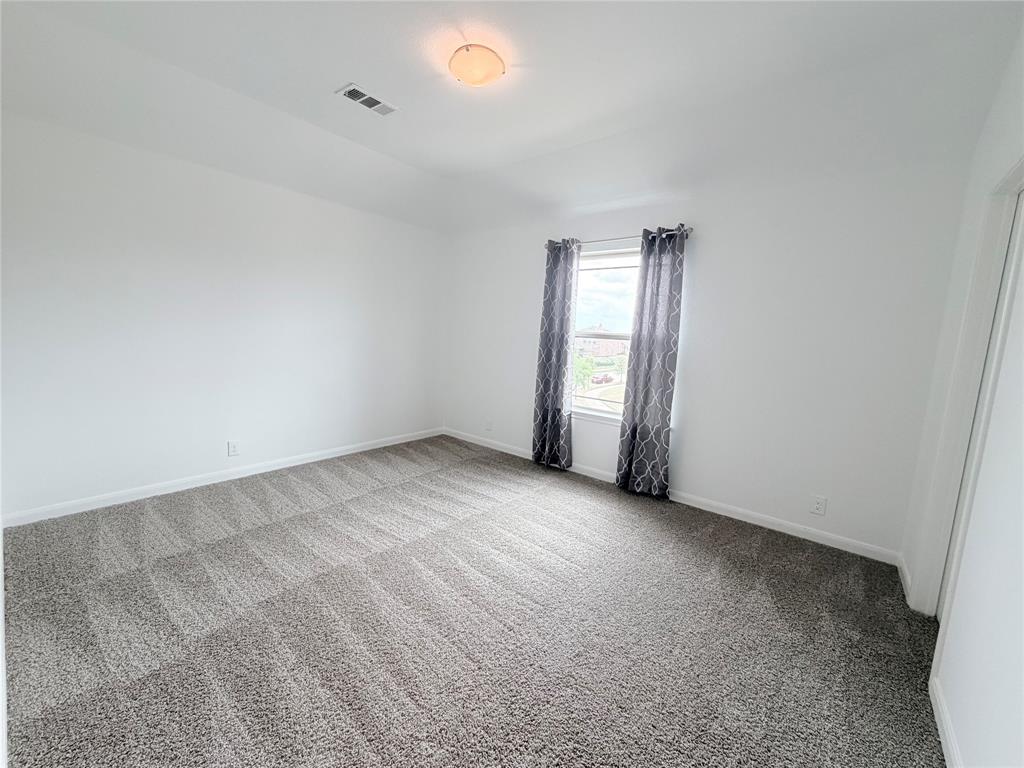 3310 Tanseyleaf Drive Forney, TX 75126 - Photo 14 of 33 an empty room with windows