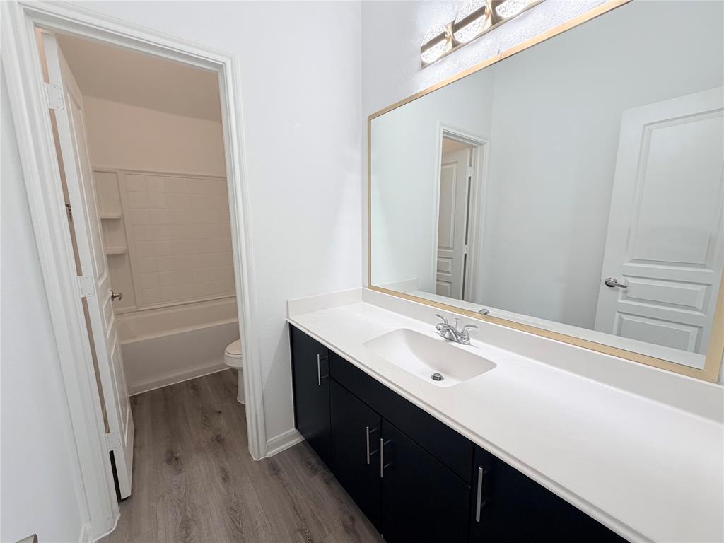 3310 Tanseyleaf Drive Forney, TX 75126 - Photo 16 of 33 a spacious bathroom with a double vanity sink a and mirror