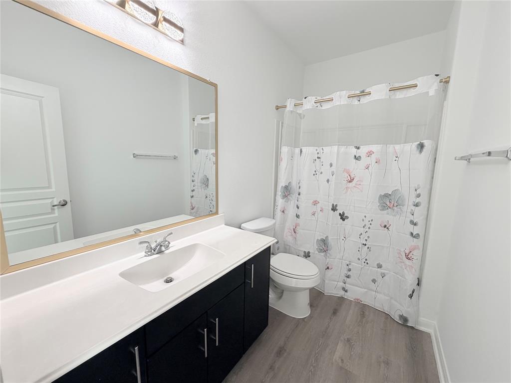 3310 Tanseyleaf Drive Forney, TX 75126 - Photo 17 of 33 a bathroom with a double vanity sink mirror and toilet