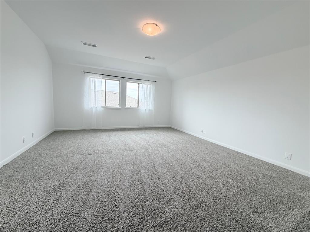 3310 Tanseyleaf Drive Forney, TX 75126 - Photo 19 of 33 an empty room with a empty space and windows