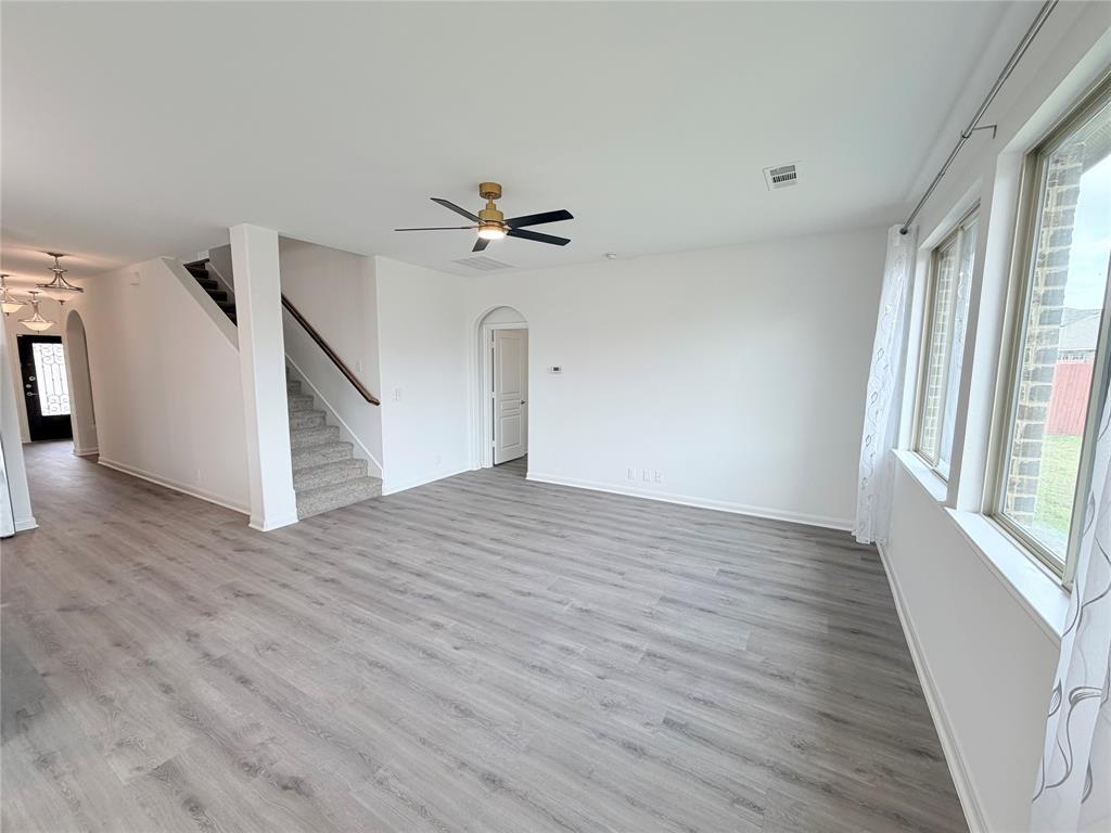 3310 Tanseyleaf Drive Forney, TX 75126 - Photo 26 of 33 a view of empty room with wooden floor and fan