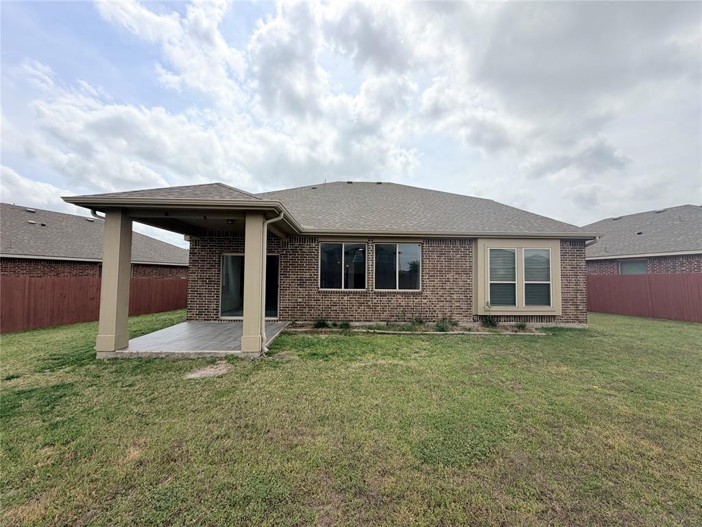 3310 Tanseyleaf Drive Forney, TX 75126 - Photo 30 of 33 a front view of a house with a yard