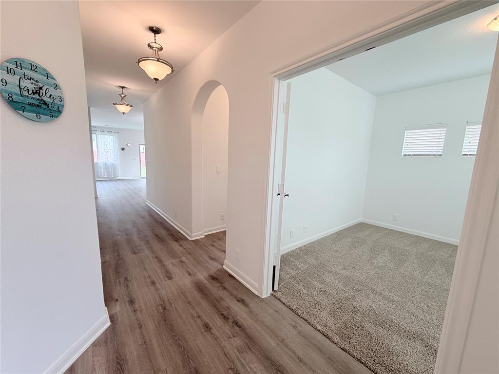 3310 Tanseyleaf Drive Forney, TX 75126 - Photo 3 of 33 wooden floor in an empty room with a window