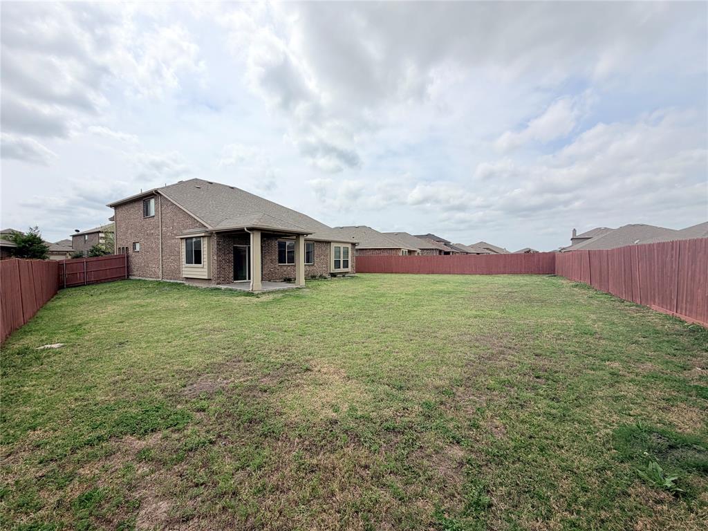 3310 Tanseyleaf Drive Forney, TX 75126 - Photo 32 of 33 a view of a house with a big yard and large tree