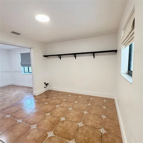 a kitchen with stainless steel appliances granite countertop a refrigerator microwave and sink