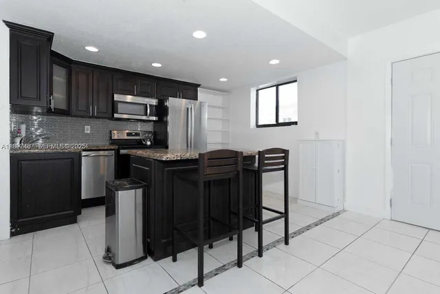 a view of an empty room with windows