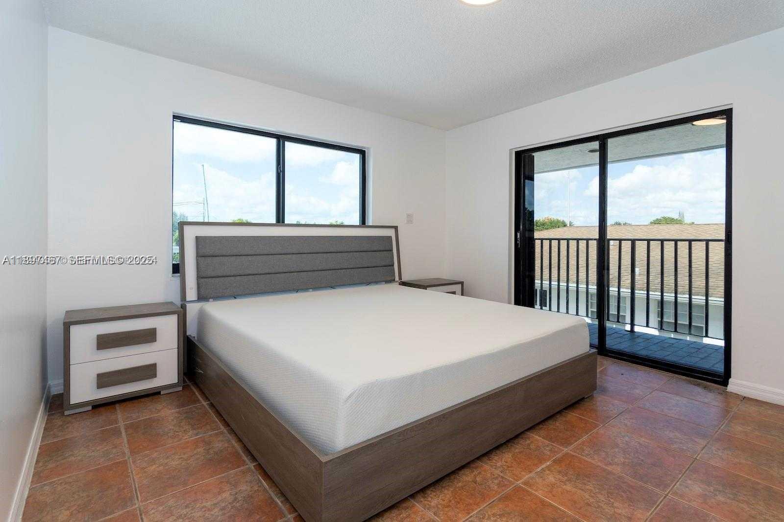 2729 Southwest 67th Avenue Miami, FL 33155 - Photo 20 of 39 a bedroom with a bed and window