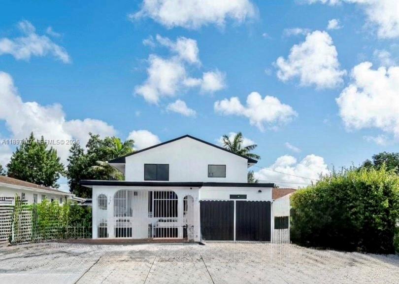2729 Southwest 67th Avenue Miami, FL 33155 - Photo 2 of 39 a view of a house with a flower garden