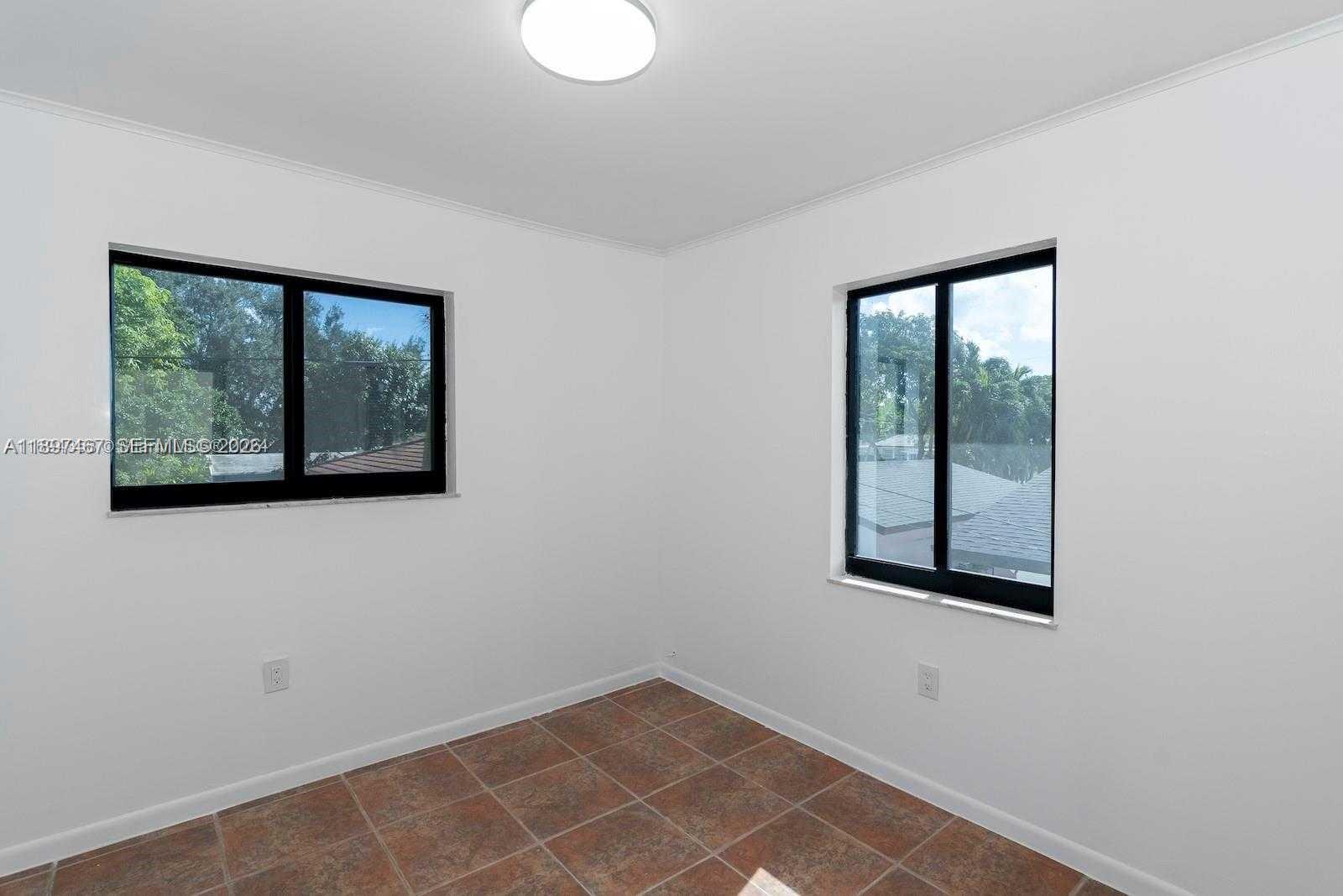 2729 Southwest 67th Avenue Miami, FL 33155 - Photo 26 of 39 an empty room with windows