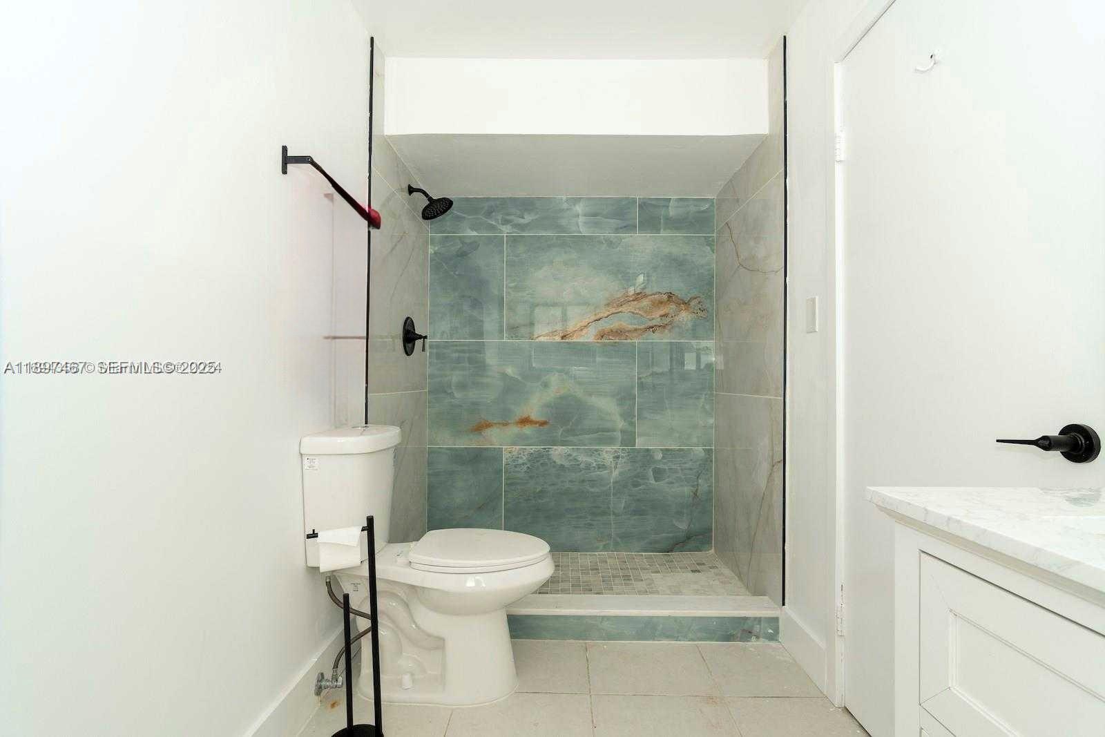 2729 Southwest 67th Avenue Miami, FL 33155 - Photo 29 of 39 a bathroom with a shower and a toilet