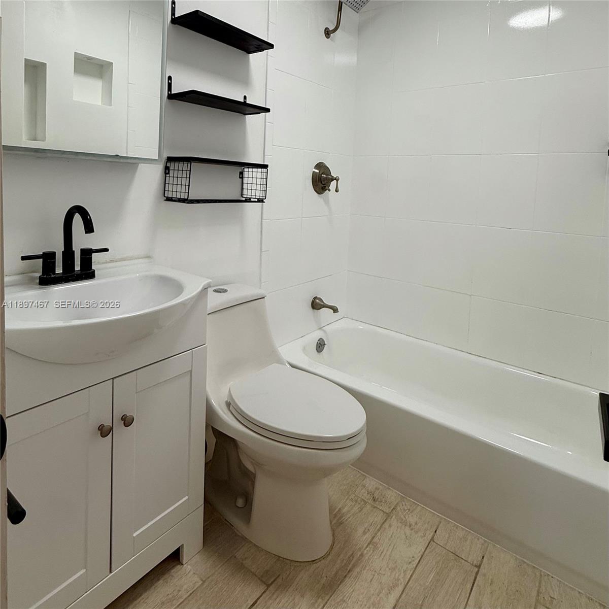 2729 Southwest 67th Avenue Miami, FL 33155 - Photo 8 of 39 a bathroom with a sink toilet and shower