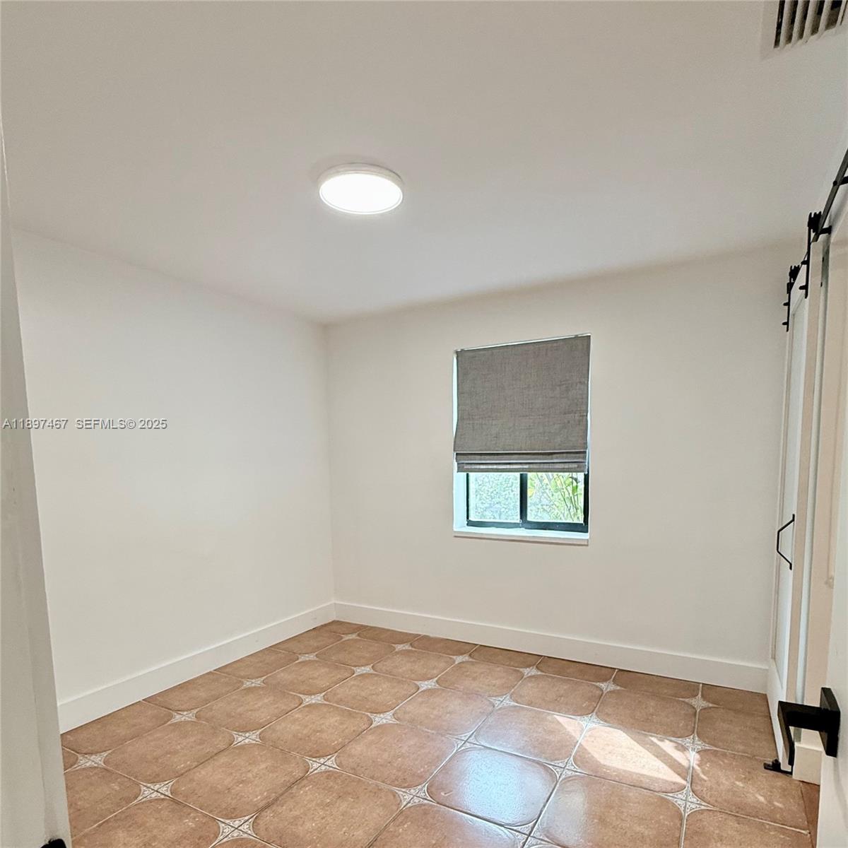 2729 Southwest 67th Avenue Miami, FL 33155 - Photo 8 of 39 an empty room with windows