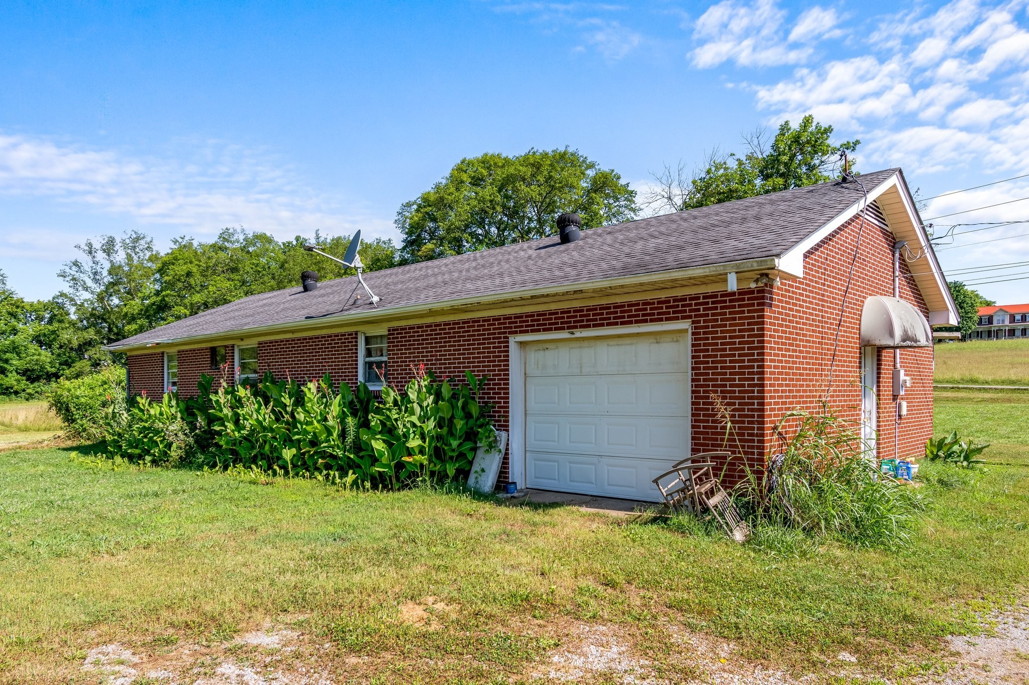 4767 Peytonsville Road Franklin, TN 37064 - Photo 18 of 35 a view of a house with a yard plants and large tree