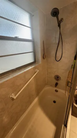a bathroom with a bath tub