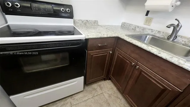 a close view of a stove top oven and sink