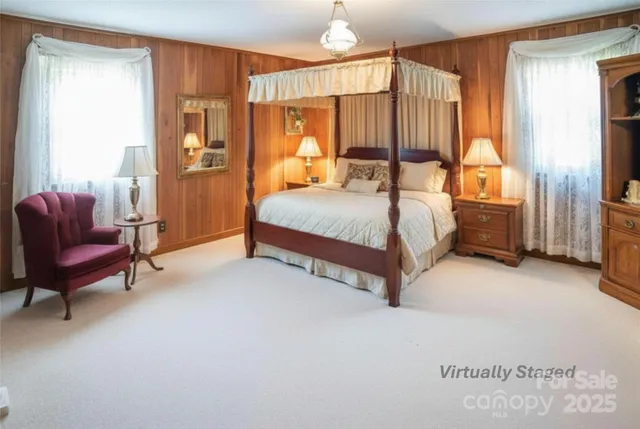 a bedroom with a bed and a couch