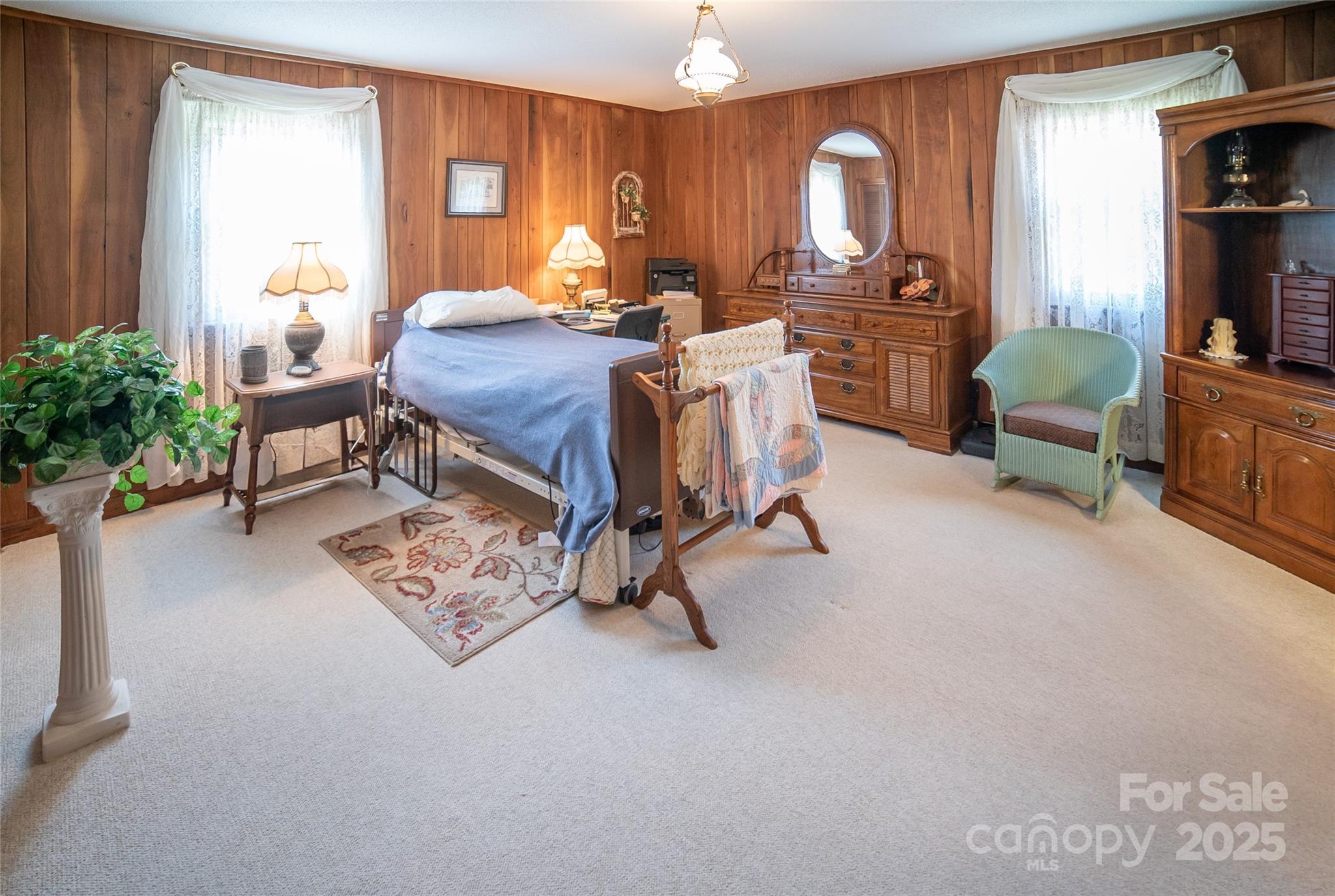 1368 Cajah Mountain Road Hudson, NC 28638 - Photo 15 of 36 a bed room with furniture a window and a flat screen tv